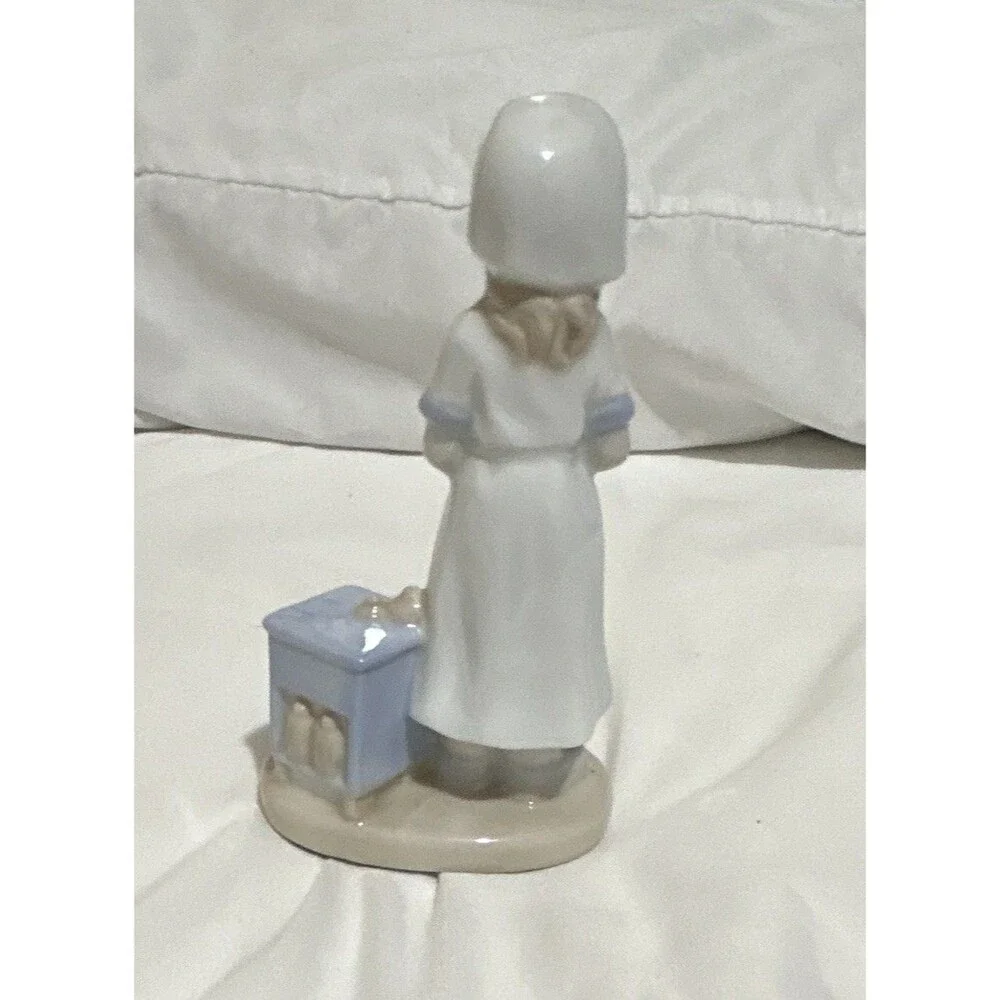 The K Collection, Inc. vintage Glazed Porcelain Nurse Figurine White/Blue